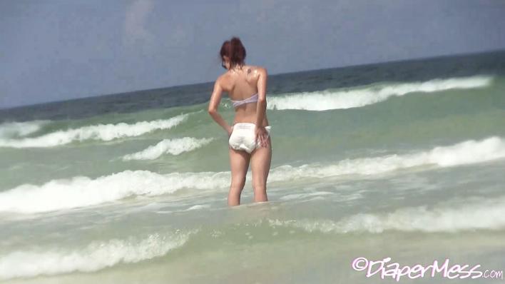 Teen Nikki Messes Her Diaper While Frolicking In The Ocean