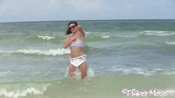 Teen Nikki Messes Her Diaper While Frolicking In The Ocean