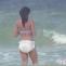 Teen Nikki Messes Her Diaper While Frolicking In The Ocean
